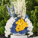 Yellow, white and blue floral display by Tyger Produtions