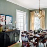Dining room with large dark wood credenza and patterned dining chairs