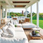 Covered porch with contemporary white upholstered furniture
