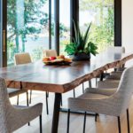 Dining area with a rustic table and contemporary chairs