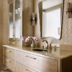 Contemporary bathroom vanity rubbed with gold powder.