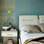 Guest room with hand painted teal wallpaper.