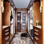 Large walk-in closet with wood cabinetry.