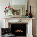 Victorian era fireplace with art deco mirror
