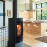 Contemporary wood burning stove in a contemporary kitchen.