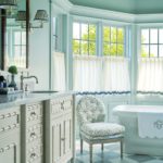 Light and airy bathroom with a large soaking tub.