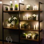 Bookshelf decorated for the holidays by Holiday scene with deer by DiCicco Design