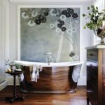Polished Nickel bathtub in front of a painted de Gournay panel