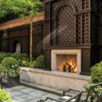 Outdoor fireplace surrounded by brown lattice