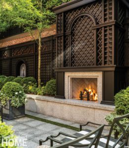 Outdoor fireplace surrounded by brown lattice
