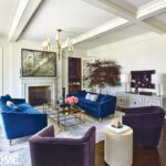 Living room with purple and blue velvet furniture.