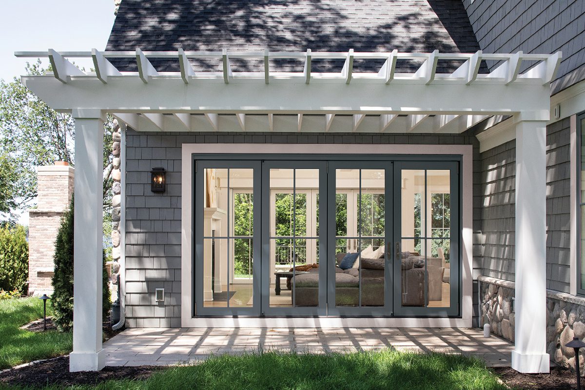 Room with a pergola off the side and a Marvin Elevate Bi-Fold Door