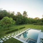Rectangular swimming pool with contemporary landscaping