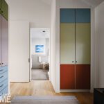 Built in closets with multi-colored doors