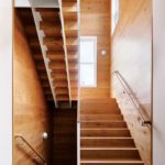 Stairway with simple wood paneling