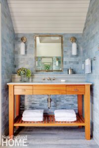 Wood vanity with an open shelf to display towels.