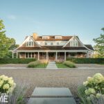 Exterior of a shingle style Martha's Vineyard house with a large gravel driveway.