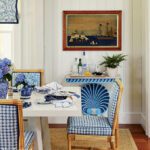 Coastal dining room with blue and white shell consoles.