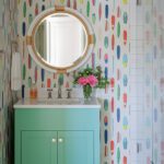 Coastal bathroom with surf board wallpaper.