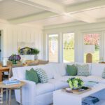 Screen porch with seating and dining area.