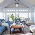 Blue and white traditional living room overlooking the coast