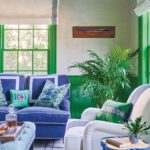 Seating area of a home office with bright green and blue accents.