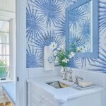 Powder room with bold blue and white wallpaper