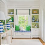 cozy window seat flanked by book cases