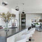White kitchen with contemporary pendants