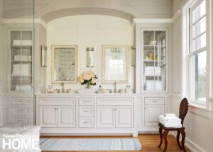 Primary bathroom with white cabinetry.