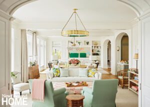 Elegant living room with white walls and pastel accents.
