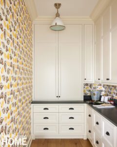 Pantry with oyster print wallpaper.