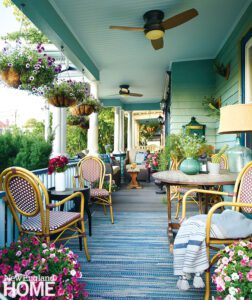 Outdoor porch with wicker and light blue walls and ceiling