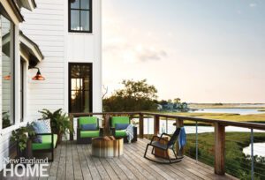 Large wooden deck with a view of an estuary.