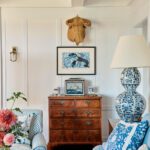 Living room vignette featuring a burled antique chest and art.