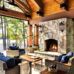 Timber frame porch with stone fireplace