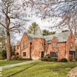 Brick exterior of Tudor Revival home.