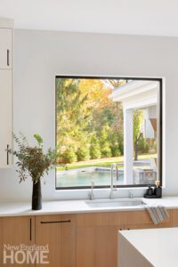 Large square pocket window in a contemporary kitchen.