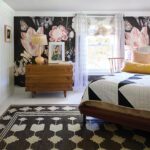 girls bedroom with large scale floral wallpaper.