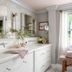 Bathroom with a white vanity and triangular zellige mosaic tile