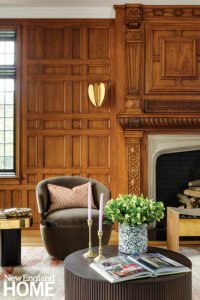 Living room fireplace with ornate oak paneling