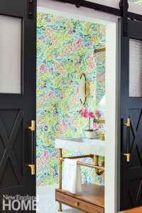 Bathroom with bright floral wall covering.