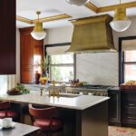 Kitchen with a coffered ceiling with brass details.