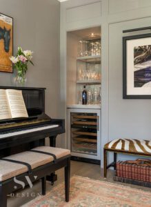 Music room with a piano and built-in bar.