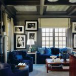 Home office with gray walls and blue velvet upholstered pieces