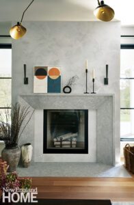 Contemporary fireplace mantel is made of Utah river stone
