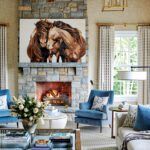 Family room with stone fireplace and horse artwork