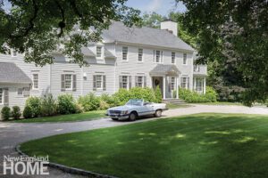 The exterior of a cream colored colonial home