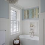 Bathroom with white tile and blue walls