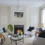 White and neutral living room with a fireplac